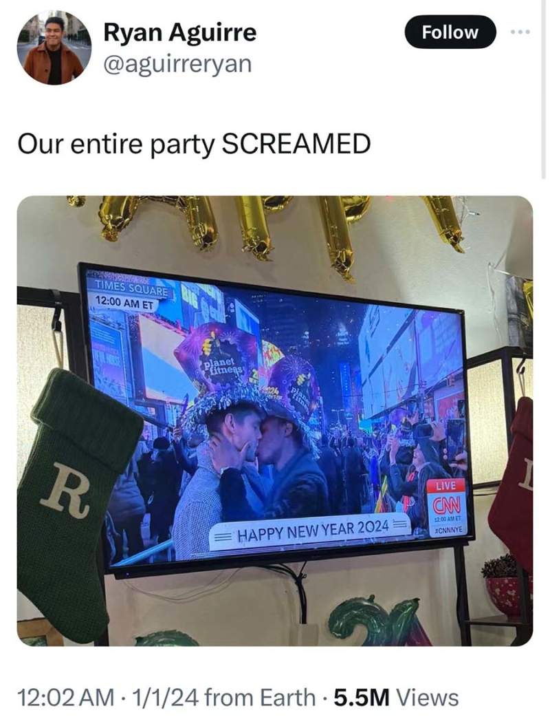 2024年新年时代广场庆祝人潮中拥吻的同性情侣